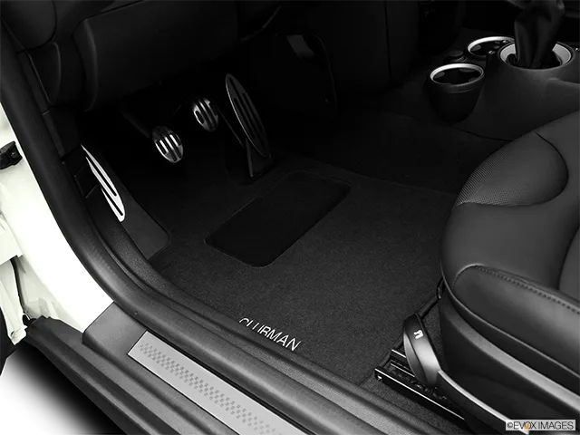 2011 MINI Cooper Clubman Driver's floor mat and pedals. Mid-seat level from outside looking in