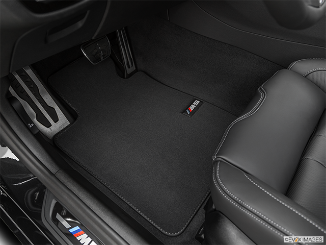 2021 BMW M5 Driver's floor mat and pedals. Mid-seat level from outside looking in